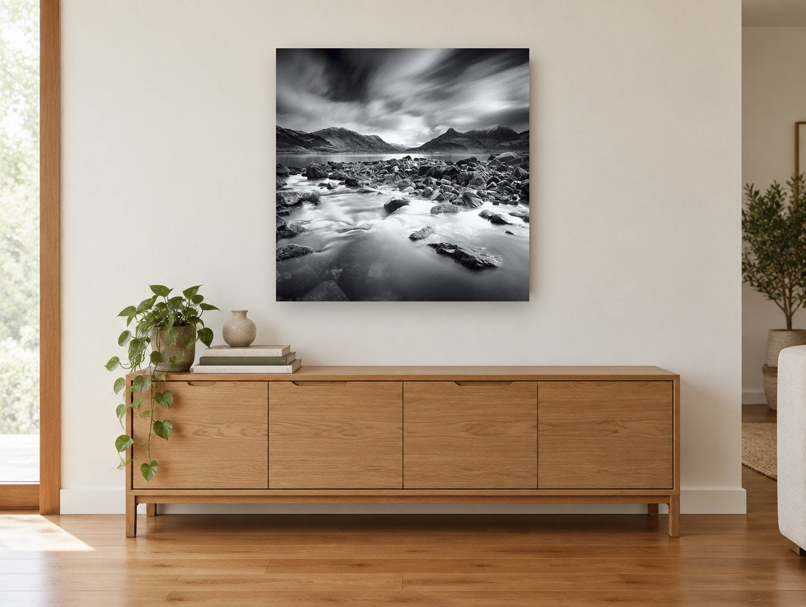 Stormlight Over Stones landscape canvas print on the wall of a living room above a sideboard