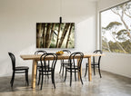 Bamboo Grove Glow landscape canvas print on the wall of a dining room
