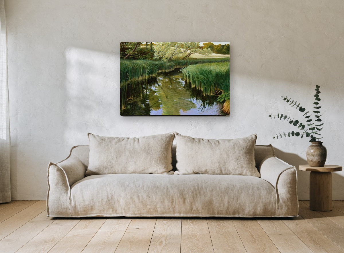 Still Creek Reeds landscape canvas print on the wall of a living room
