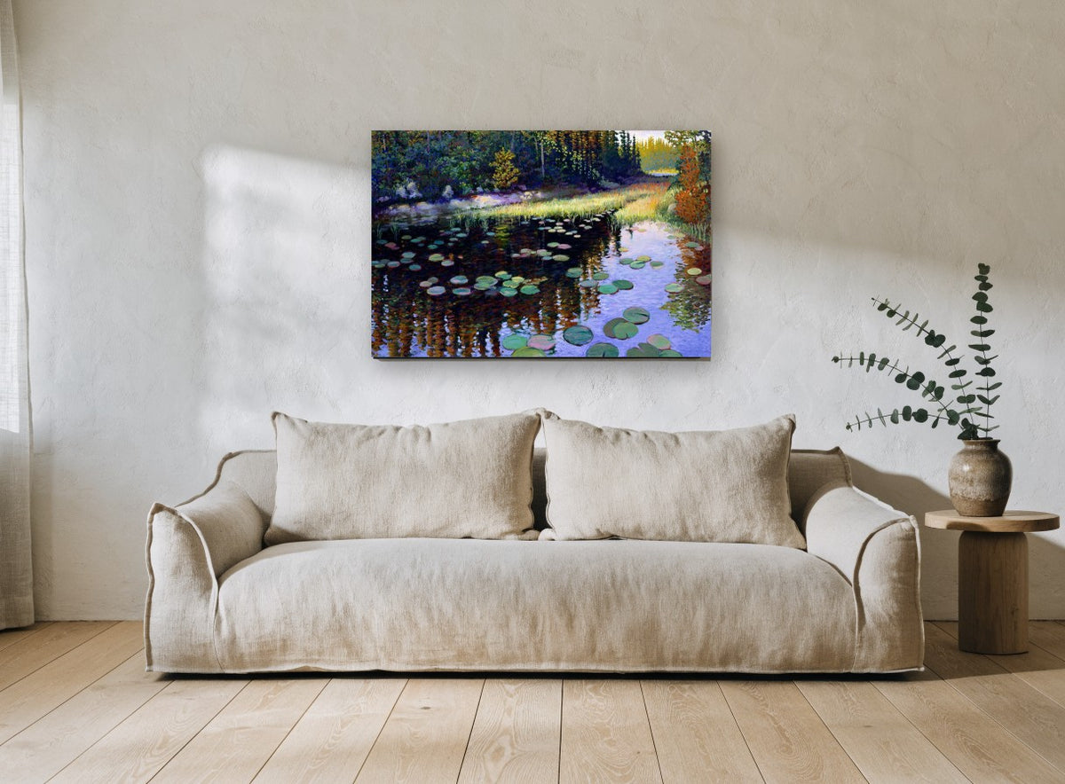Lily Pond Reflections landscape canvas print on the wall of a living room