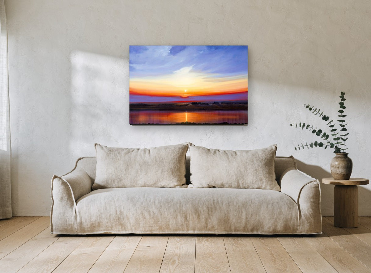 Sunset Over Still Water landscape canvas print on the wall of a living room