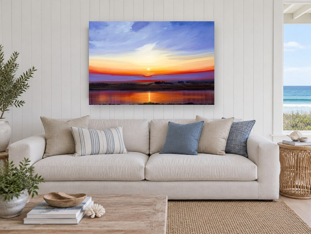 Sunset Over Still Water landscape canvas print on the wall of a beach house living room