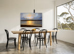 Golden Moon Over Water landscape canvas print on the wall of a dining room
