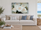 Cream Rose Cluster floral canvas print on the wall of a beach house living room