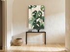 Monstera on Linen floral canvas print on the wall of a hallway