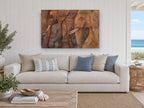 Elephant Procession in Earth Tones animal canvas print on the wall of a beach house living room