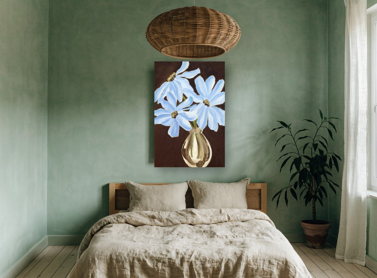 Blue Blooms on Brown floral canvas print on the wall of a bedroom