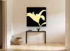 Golden Lily Silhouette floral canvas print on the wall of a hallway