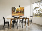 Red Barn in Autumn Light landscape canvas print on the wall of a dining room