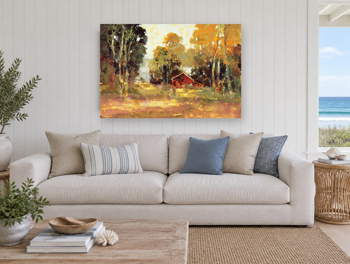 Red Barn in Autumn Light landscape canvas print on the wall of a beach house living room