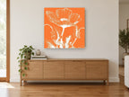 Orange Poppy Silhouette floral canvas print on the wall of a living room above a sideboard