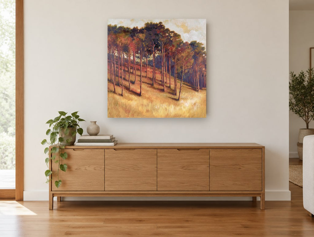 Amber Hillside Grove landscape canvas print on the wall of a living room above a sideboard