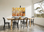 Golden Aspen Trunks landscape canvas print on the wall of a dining room
