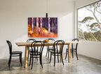 Backlit Amber Trunks landscape canvas print on the wall of a dining room