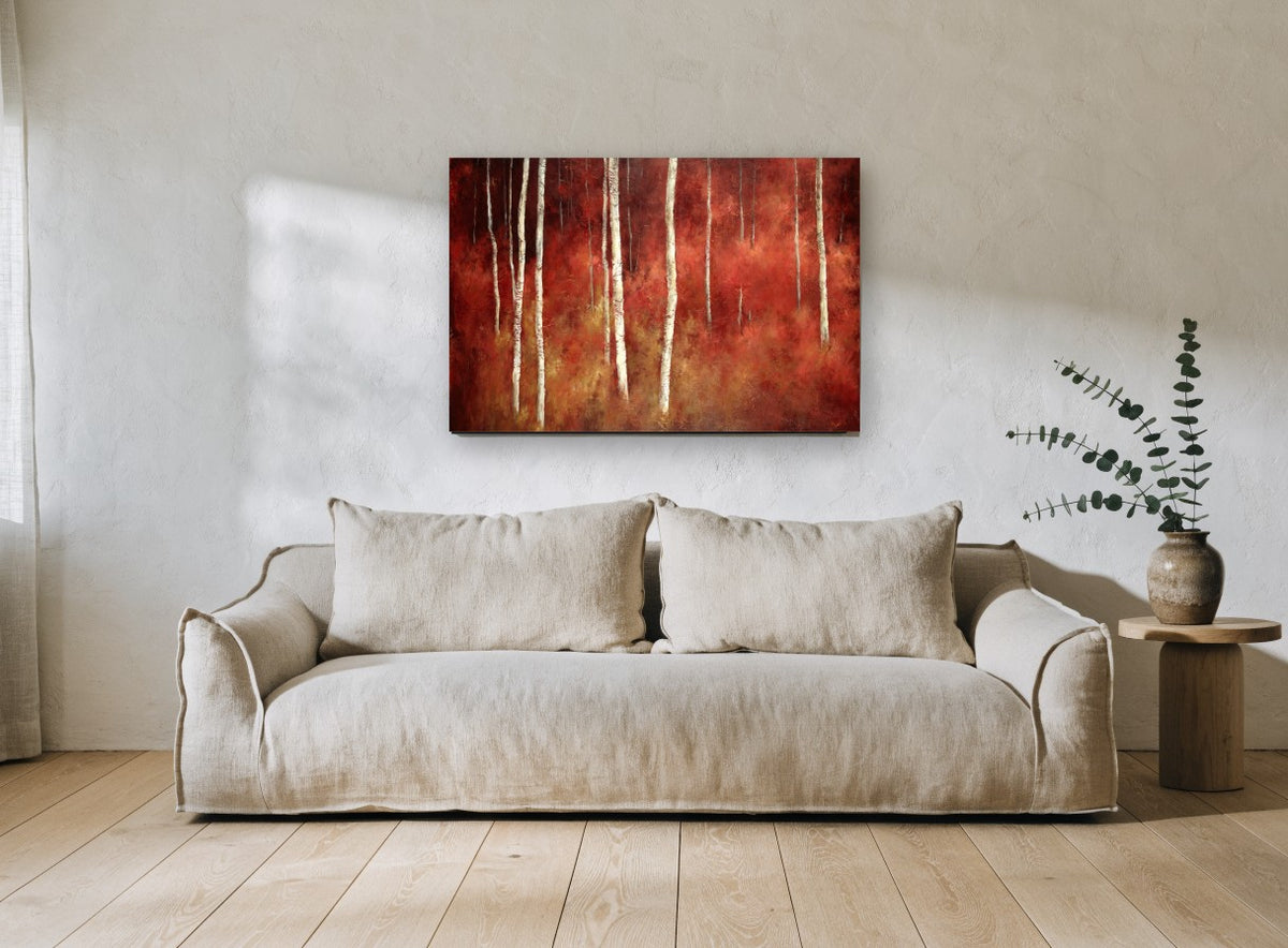 Crimson Birch Glow landscape canvas print on the wall of a living room