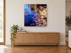 Autumn Pond Drift landscape canvas print on the wall of a living room above a sideboard