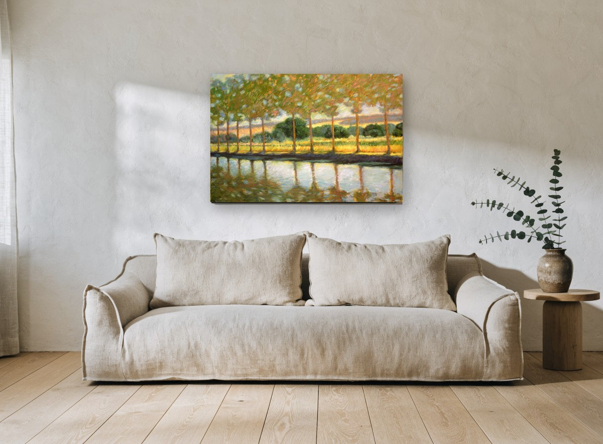 Poplars Beside Still Water landscape canvas print on the wall of a living room