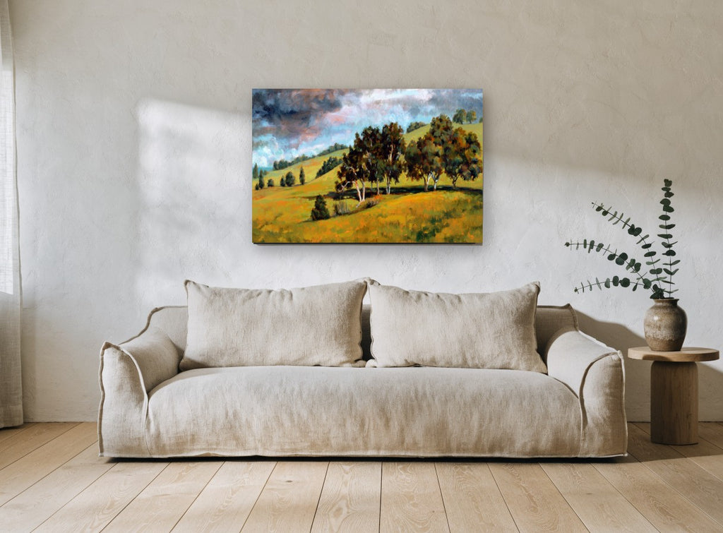 Storm Over Golden Hills landscape canvas print on the wall of a living room