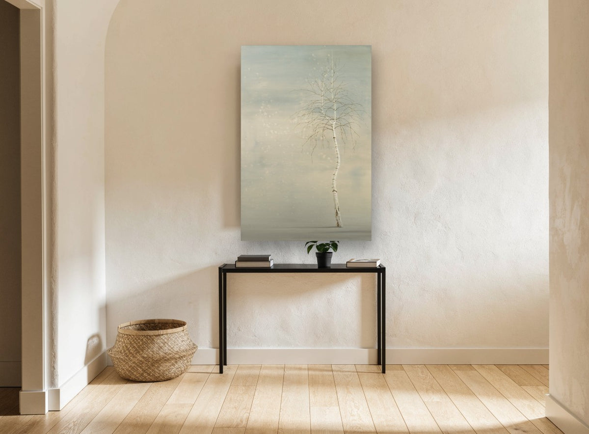 Lone Birch in Snowfall landscape canvas print on the wall of a hallway