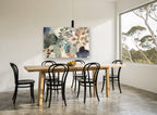 Layered Leaf Wash floral canvas print on the wall of a dining room