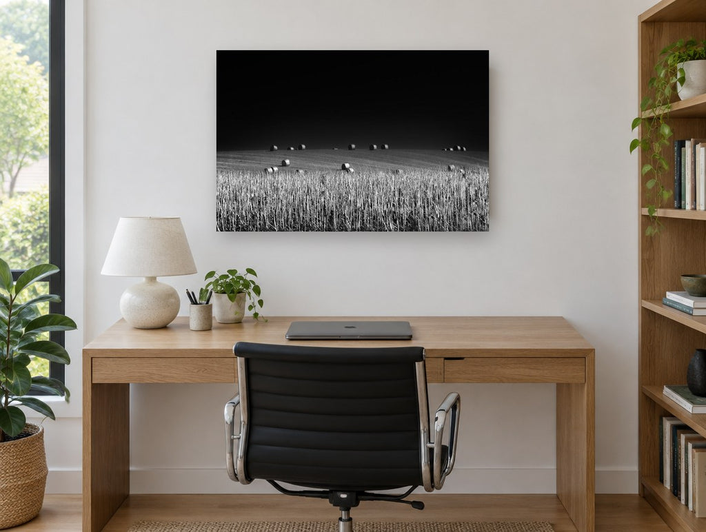 Bales Under Dark Sky landscape canvas print on the wall of a study