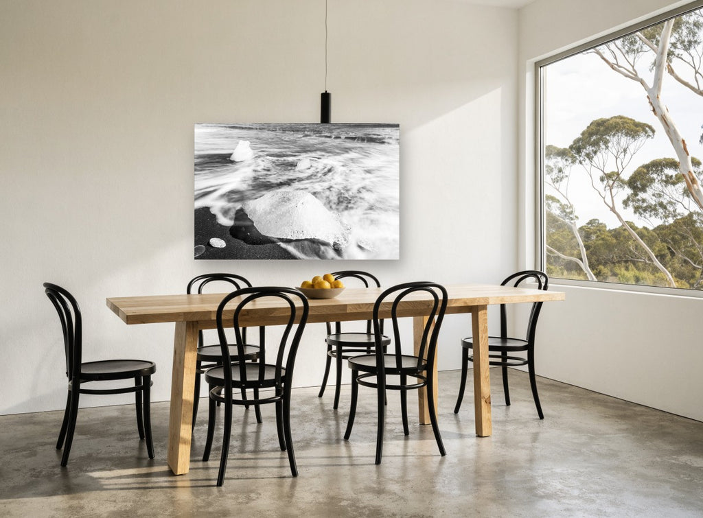 Ice on Black Sand coastal canvas print on the wall of a dining room