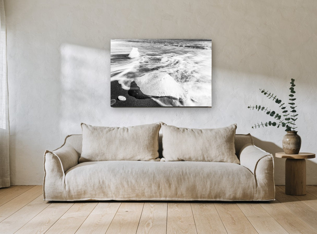 Ice on Black Sand coastal canvas print on the wall of a living room