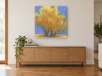 Golden Cottonwood Trio landscape canvas print on the wall of a living room above a sideboard