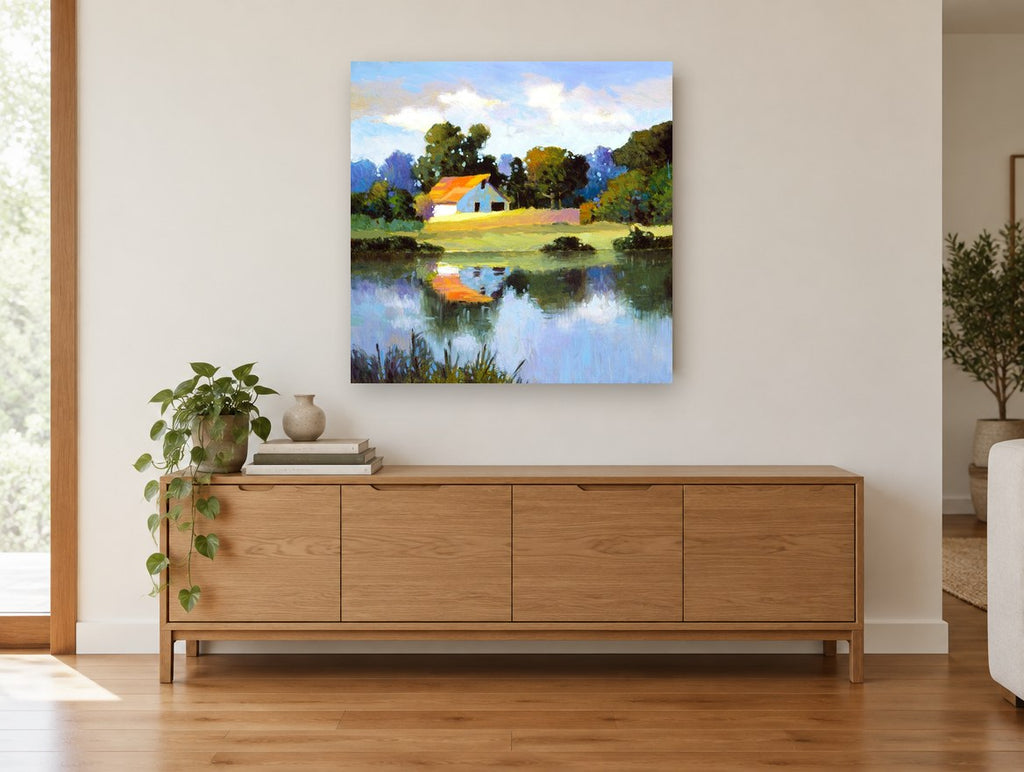 Orange Roof Pond landscape canvas print on the wall of a living room above a sideboard