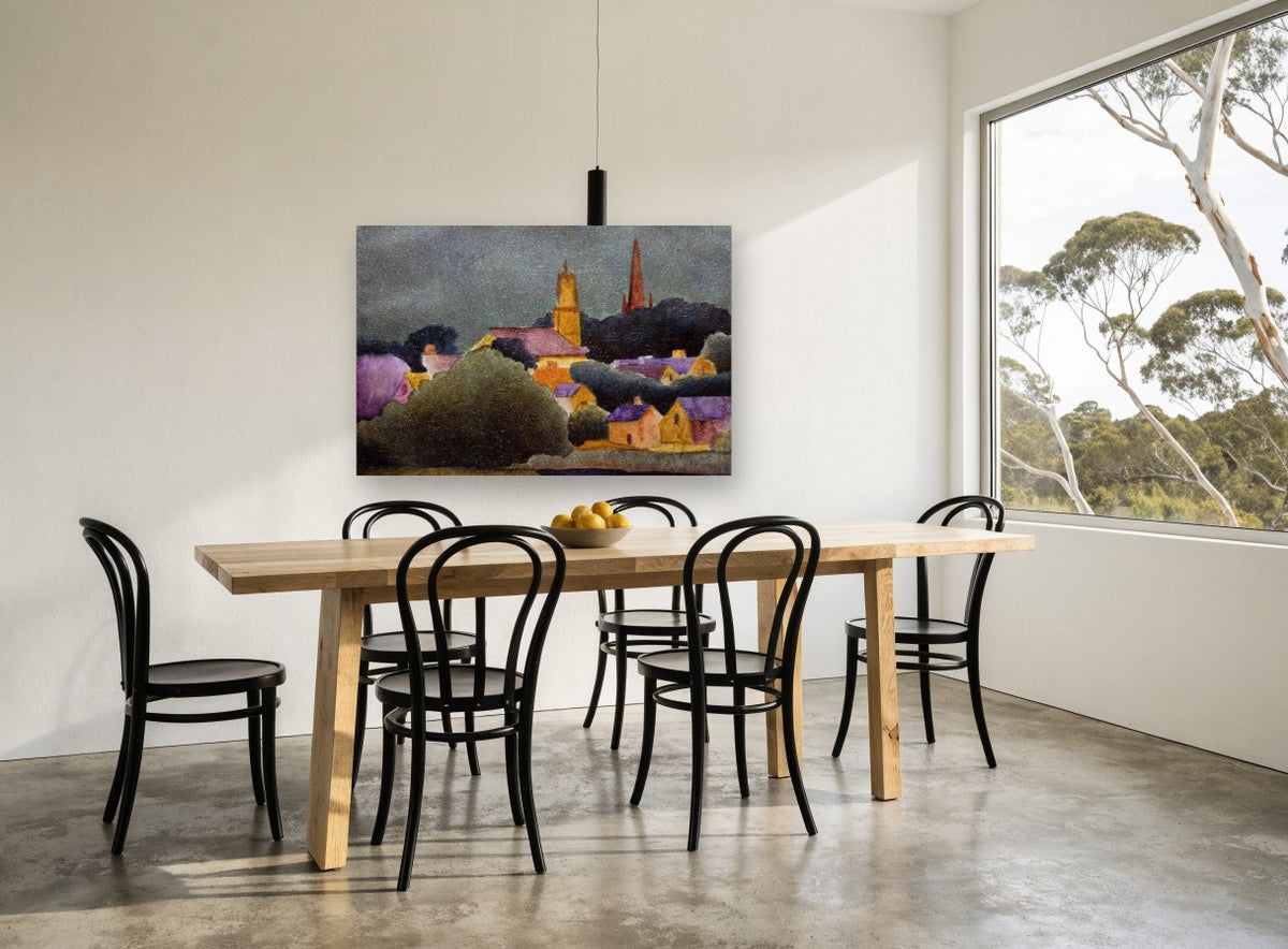 Village Beneath Storm Sky landscape canvas print on the wall of a dining room