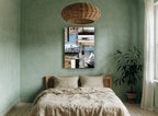 A Bientôt Travel Collage vintage canvas print on the wall of a bedroom