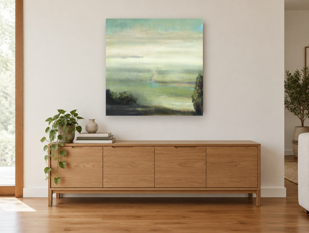Valley Mist Green landscape canvas print on the wall of a living room above a sideboard