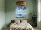 Stone in the Swirl coastal canvas print on the wall of a bedroom