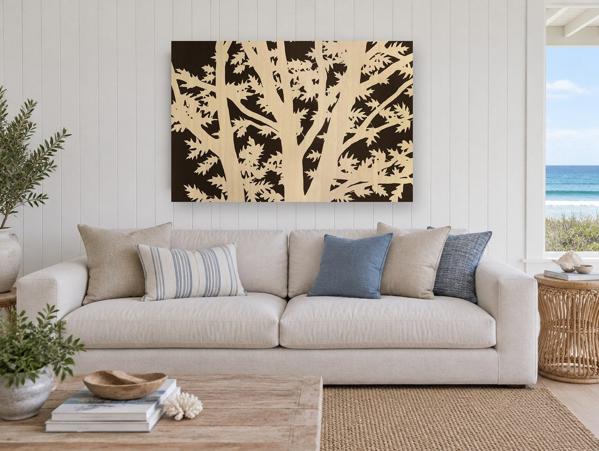 Oak Branch Silhouette floral canvas print on the wall of a beach house living room