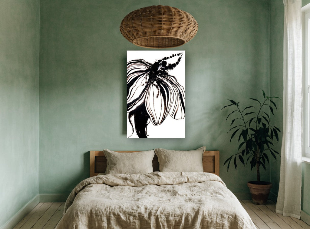 Inked Bloom in Black floral canvas print on the wall of a bedroom