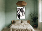 Inked Bloom in Black floral canvas print on the wall of a bedroom