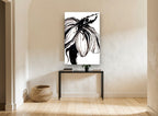 Inked Bloom in Black floral canvas print on the wall of a hallway