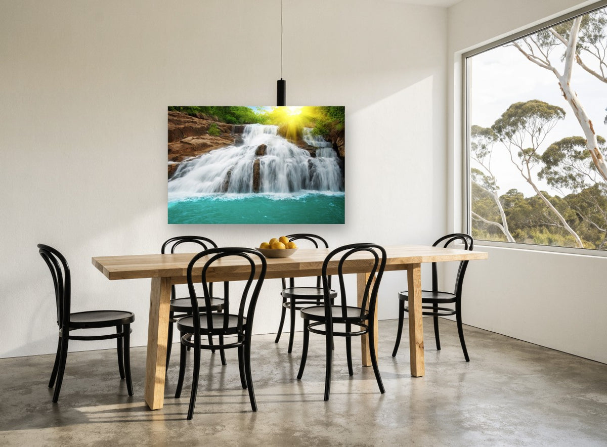 Sunlit Turquoise Cascade coastal canvas print on the wall of a dining room