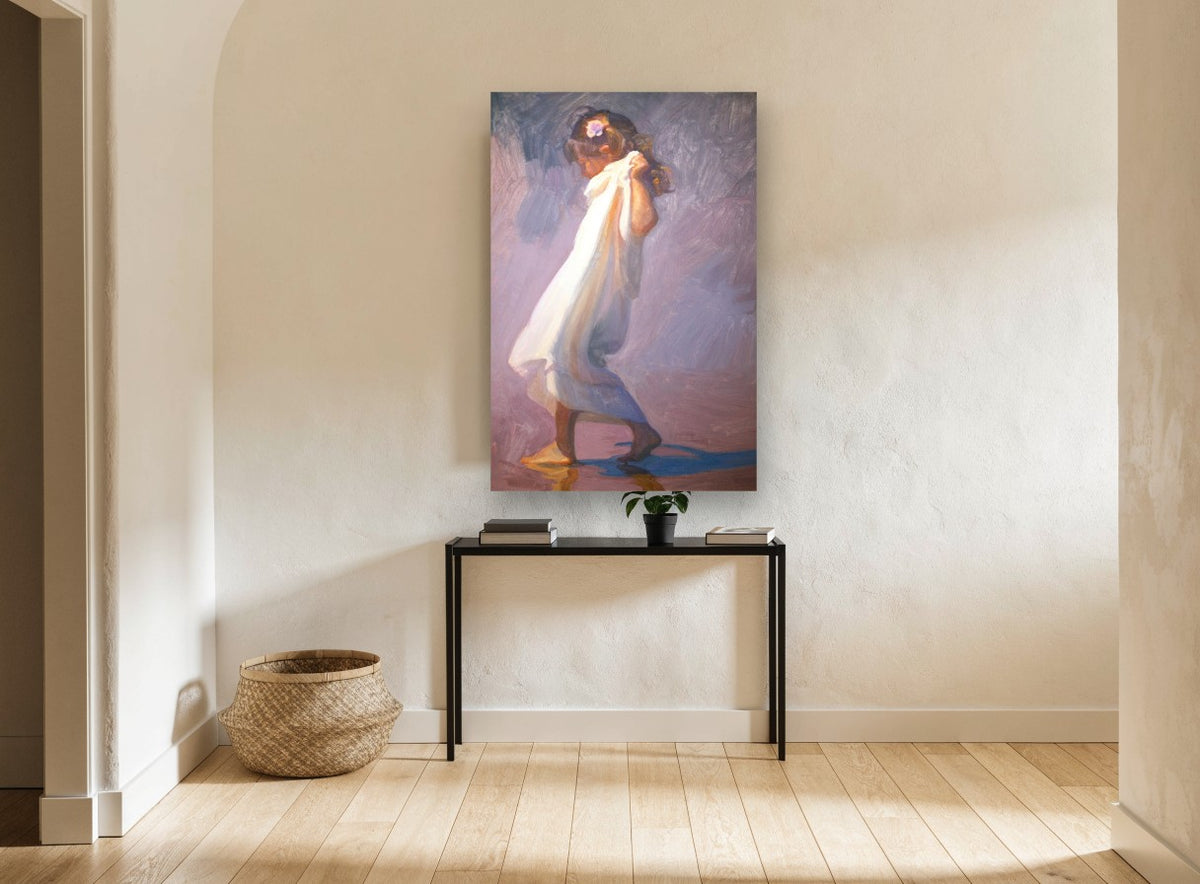 Girl in White Wrap coastal canvas print on the wall of a hallway