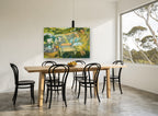 Reading in the Garden floral canvas print on the wall of a dining room