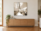 Furled Sail Sepia coastal canvas print on the wall of a living room above a sideboard