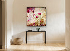Magenta Allium Haze floral canvas print on the wall of a hallway