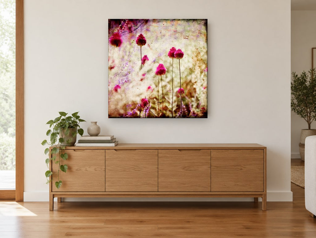 Magenta Allium Haze floral canvas print on the wall of a living room above a sideboard