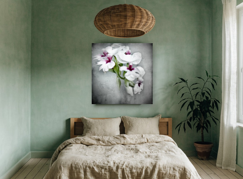 Soft Orchid Spray floral canvas print on the wall of a bedroom
