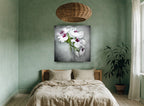 Soft Orchid Spray floral canvas print on the wall of a bedroom