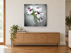 Soft Orchid Spray floral canvas print on the wall of a living room above a sideboard