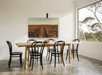 Golden Outback Road landscape canvas print on the wall of a dining room