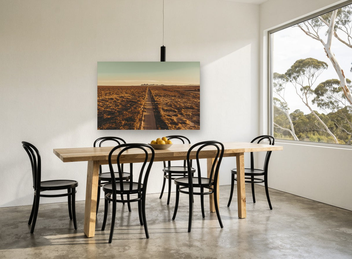Golden Outback Road landscape canvas print on the wall of a dining room