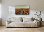 Golden Outback Road landscape canvas print on the wall of a living room