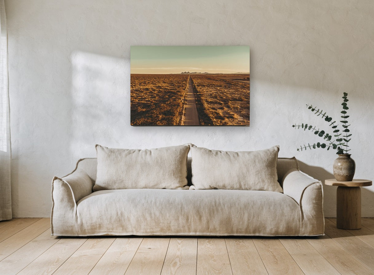 Golden Outback Road landscape canvas print on the wall of a living room